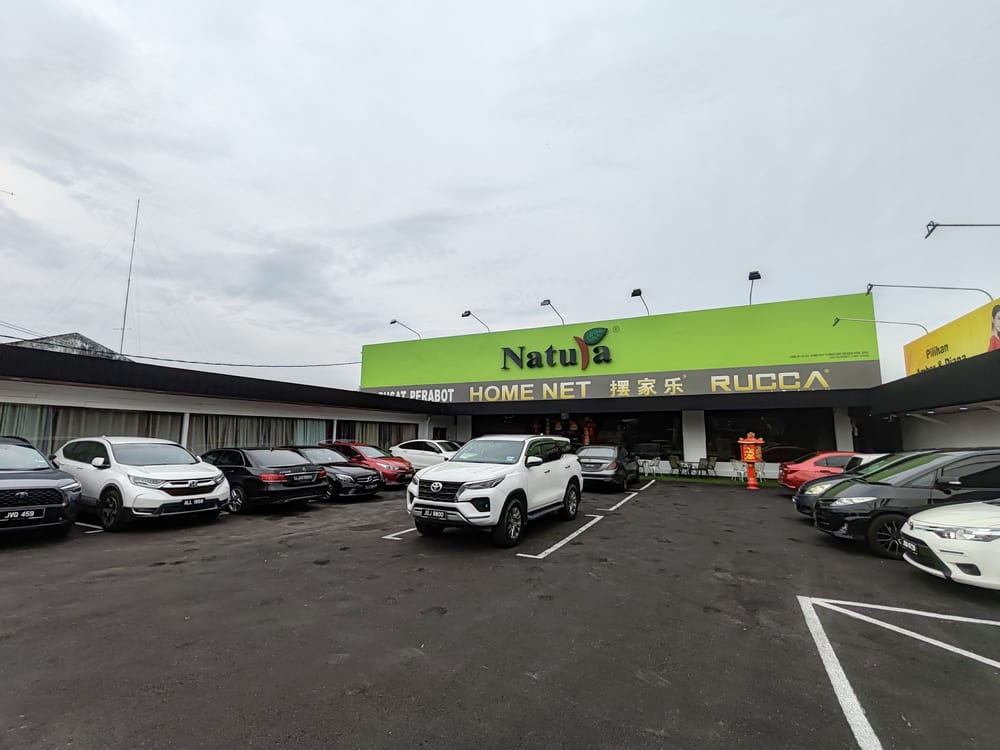 The same shoplot frontage seen from across the carpark.