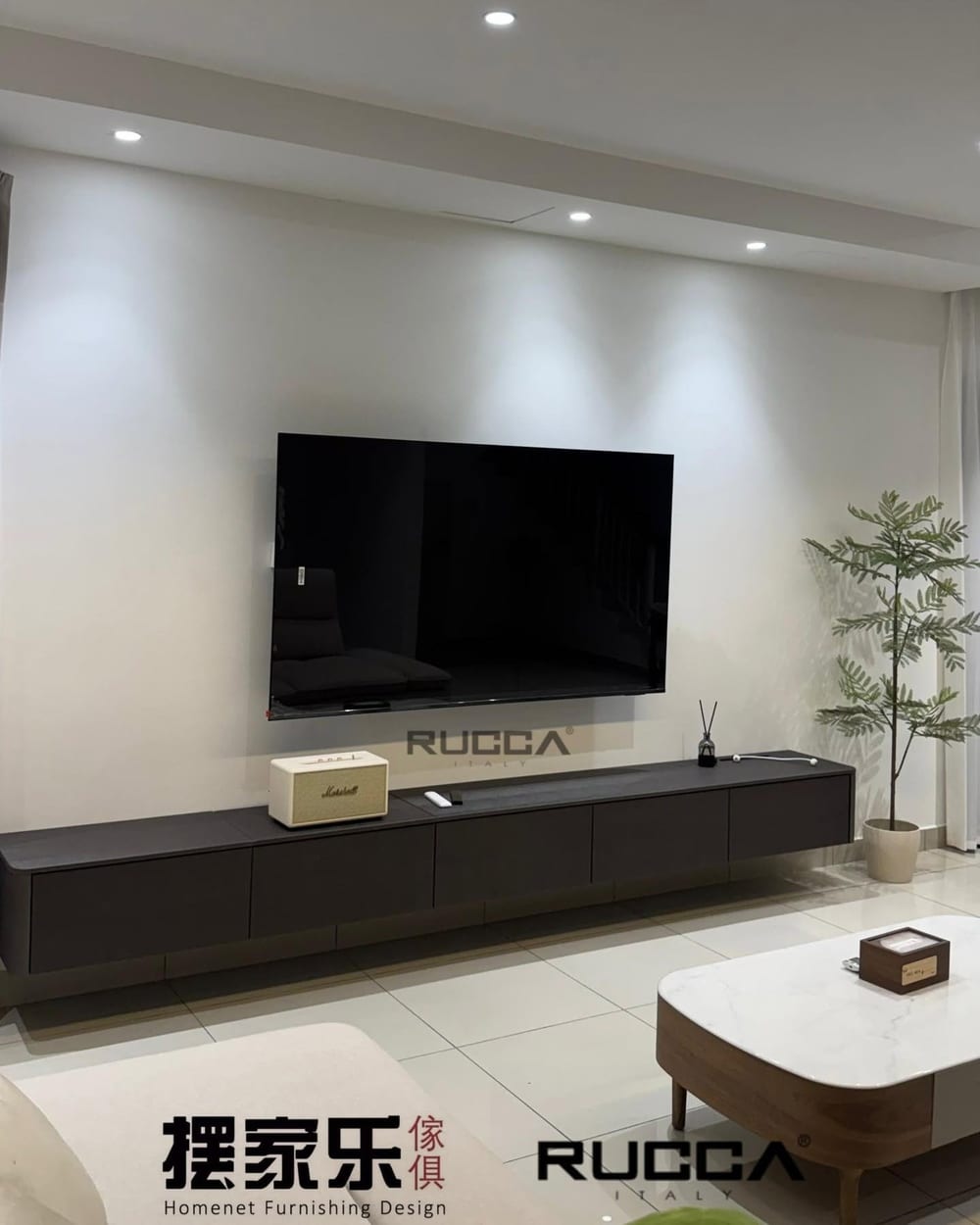 A television feature wall with a floating stone-topped console below the screen.