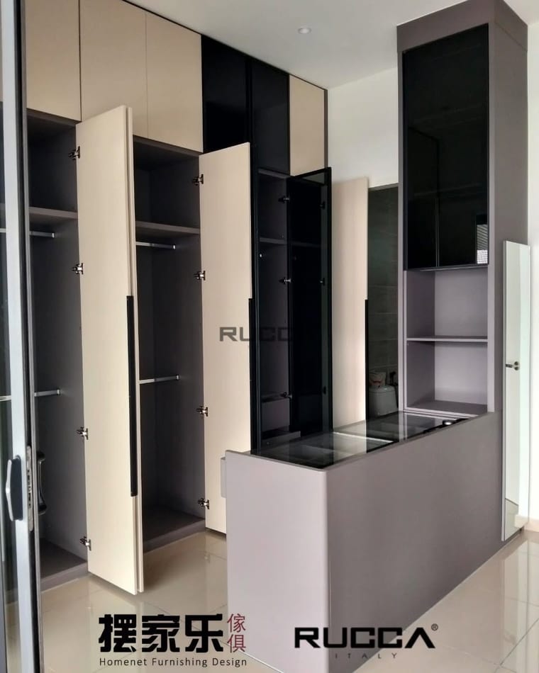 A built-in wardrobe with its doors open, showing the hanging rails and shelves inside.